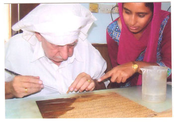 SP Singh and Iqbal Kaur working on matching the broken SP Singh and Iqbal Kaur working on matching the broken