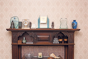 Mantelpiece, holding ornaments and various awards Mantelpiece, holding ornaments and various awards