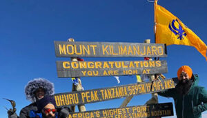 Flying the Nishan Sahib on Mt. Kilimanjaro