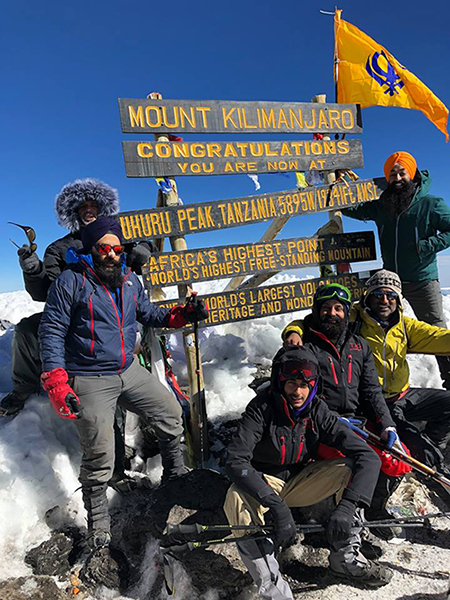 Flying the Nishan Sahib on Mt. Kilimanjaro